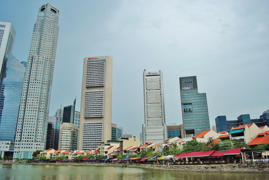 Singapore landscape. Traditional old buildings and skyscrapers in the background.