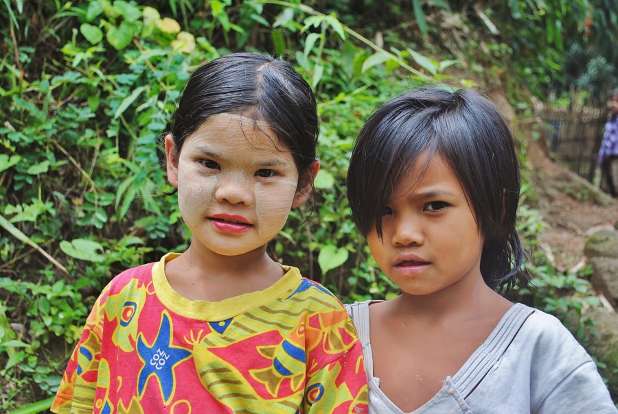 Children in Burma. One of the girls has her face painted with the popular tree bark make-up. It is called thanaka, and it protects against the sun.